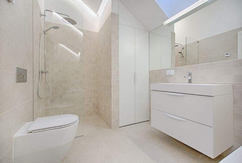 White tiled bathroom walls and floor