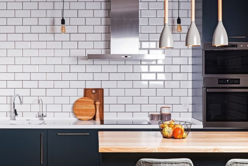 Kitchen tiling job with a white tiled splashback