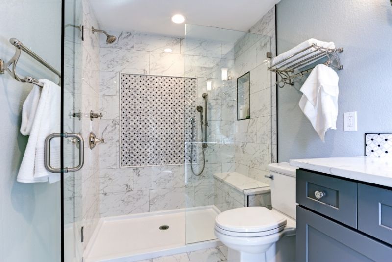 Newly renovated bathroom in white tiles for a residential client