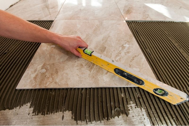 Tilers Woonona leveling a ceramic floor tiles
