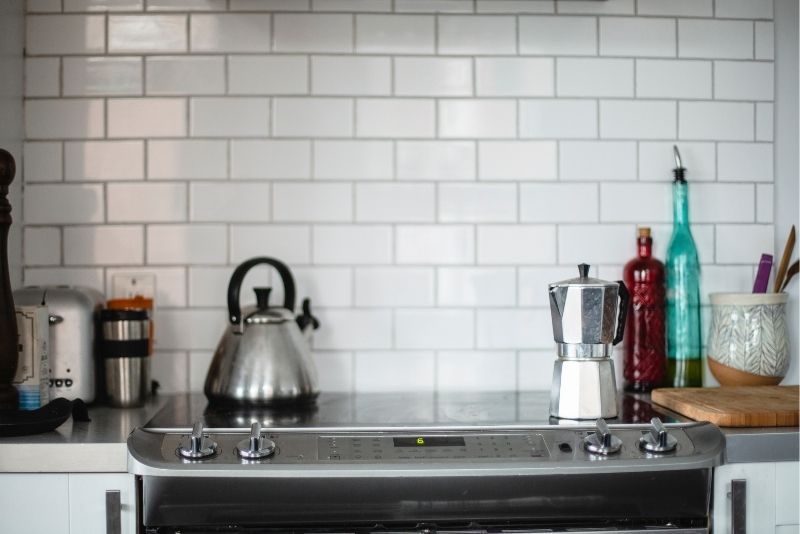 Kitchen wall tiling installation with grouted tile joints