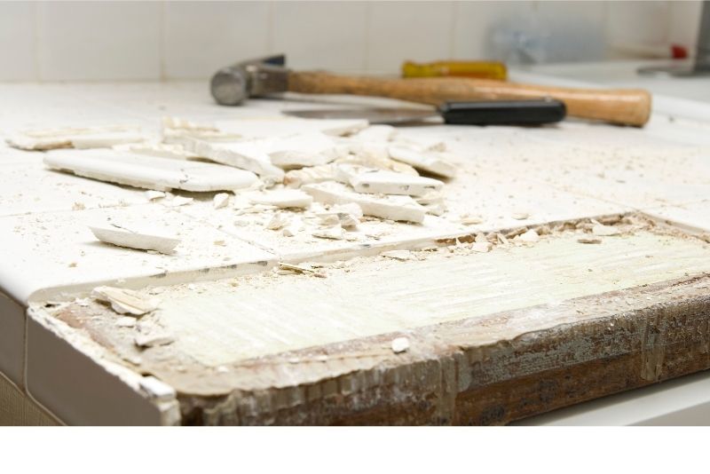 Tile being removed from a kitchen counter